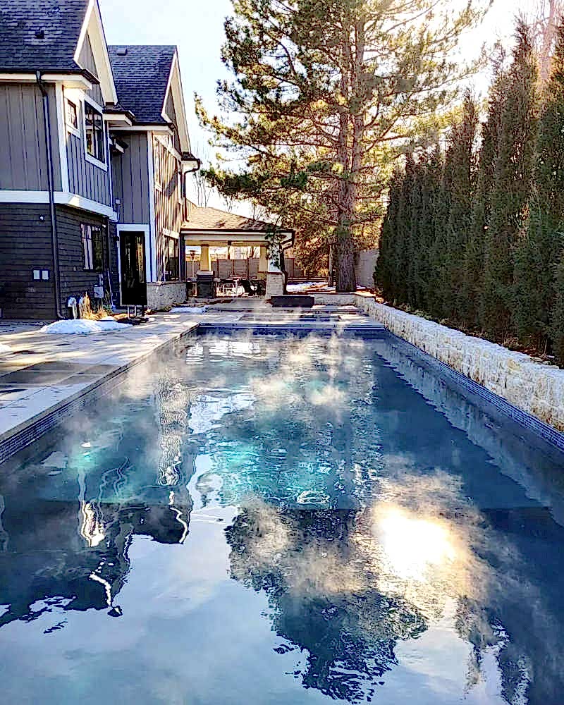 Kid with Broncos hat enjoying pool